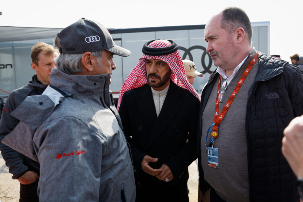 Carlos Sainz with FIA President Mohammed Ben Sulayem and Robert Reid